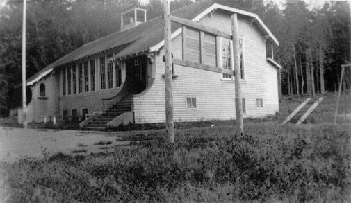 Black and white photo of the original church building when it was the schoolhouse in Seabeck, WA